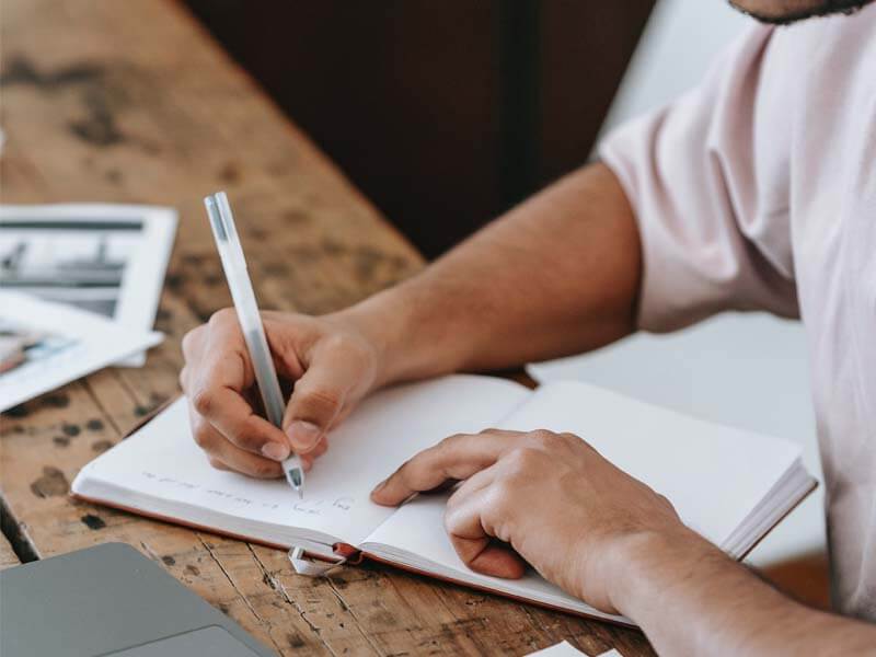 Taking notes in a notebook